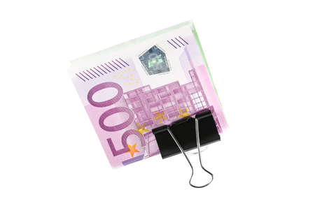 Bundle of 500 Euro bank notes fasten with paper clip isolated on white backgroundの写真素材
