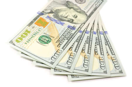 A pile of new isolated 2013 hundred dollar bills, isolated on white background with soft focusの写真素材