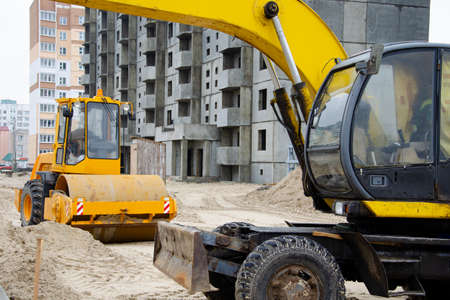Heavy construction equipment at the construction of a multi-storey buildingの写真素材
