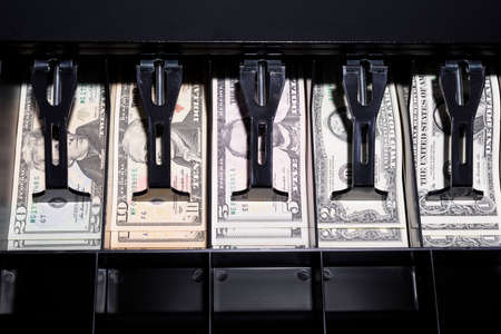 Dollars in the cash drawer, shallow depth of fieldの写真素材