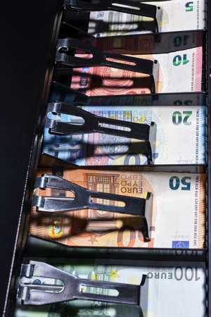 Euro in the cash drawer, shallow depth of fieldの写真素材