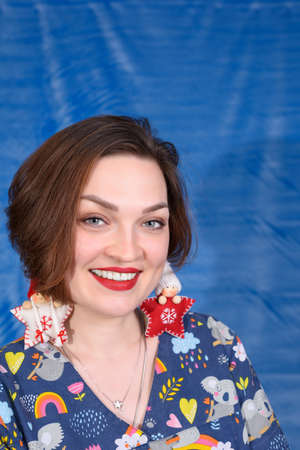 Photo of a pediatrician on a blue background with a stethoscopeの写真素材
