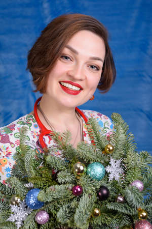 Photo of a pediatrician on a blue background with a stethoscopeの写真素材