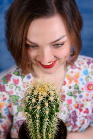 Portrait of a girl on a blue backgroundの写真素材