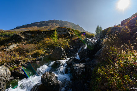 Small mountain stream, cascade, waterfall in the Alpsの写真素材