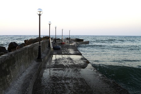 Sea pier with lanterns at sunset. Greeceの写真素材