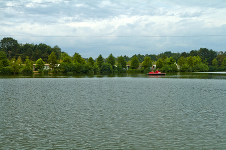 Lake in the park, view from the boat.の写真素材