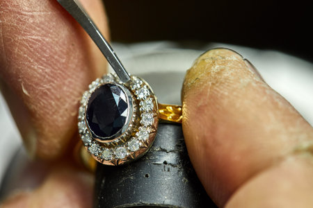 Jewelry production. The process of fixing stones with a fixer. Jewelry makingの写真素材