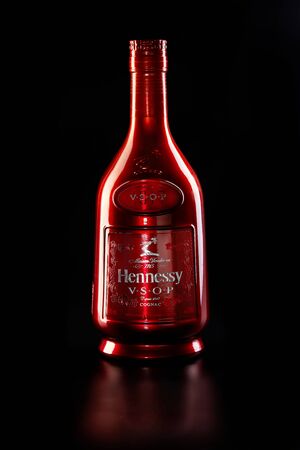 Tel Aviv, Israel - June 15, 2019. Tel Aviv, Israel - June 15, 2019. Bottle of French cognac Hennessy V.S.O.P is isolated on a black background.のeditorial素材