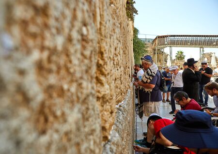 Jerusalem, Israel - July 10, 2019: View of unknowns people praying front the Western wall in the old city of Jerusalem. The Wailing Wall - Day of Jerusalem, Yom Kippur, Sukkotのeditorial素材