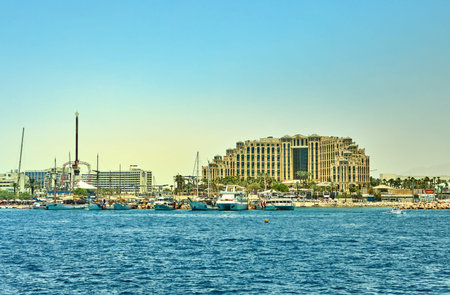 Eilat, Israel - July 13, 2019: View from the luxury yacht to the Red Sea. Hotels for tourists, boats...