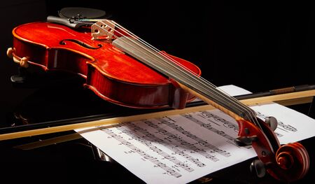 Tel Aviv, Israel - September 30, 2019: Violin on a black background, close-up. music concept. Details of the violin.のeditorial素材