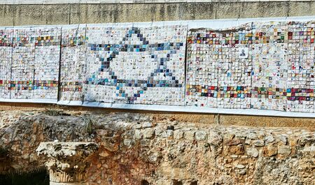 Jerusalem, Israel - October 21, 2019: A panel made of drawings of children with Magen David on the walls of the old city of Jerusalem in the Jewish quarter of the city.のeditorial素材