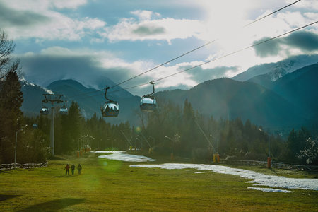 Bansko, Bulgaria - December 27, 2019: Ski resort center in Bulgaria. Cableway for climbing the...