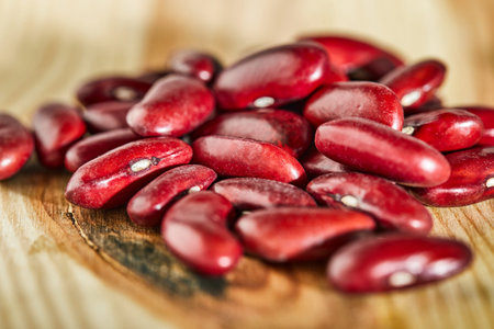 Red beans seeds on a wooden background. Close up. Healthy eating concept.
