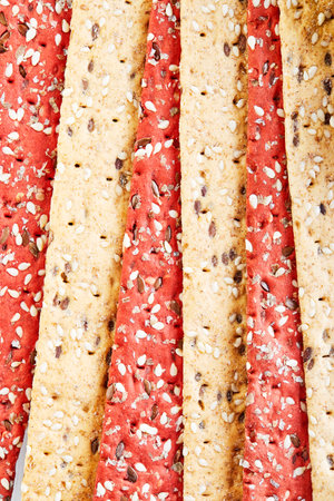 Beetroot and rye flour crackers with vegetables for making snacks background texture. Vegetarianism and healthy eating.の写真素材