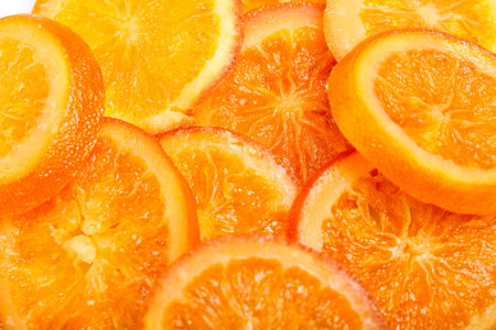 Slices Dried oranges or tangerines isolated on a white background. Vegetarianism and healthy eating.