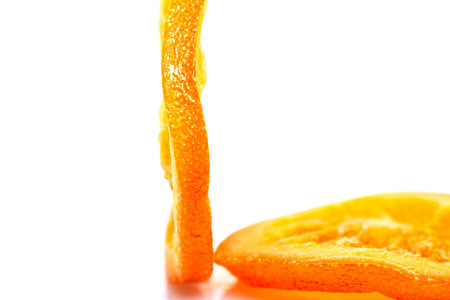 Slices Dried oranges or tangerines isolated on a white background. Vegetarianism and healthy eating.の写真素材