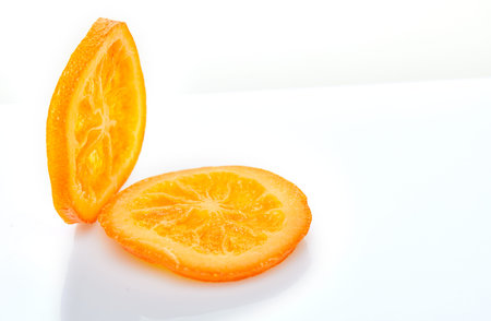 Slices Dried oranges or tangerines isolated on a white background. Vegetarianism and healthy eating.の写真素材