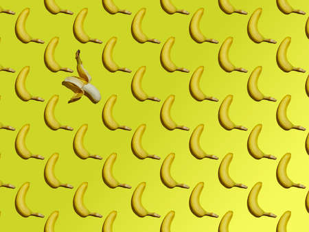 A pattern from a whole ripe bananas isolated on a yellow gradient background.の写真素材
