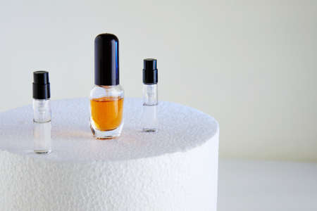 Dropper Bottle for perfume bottles without labels on a white podium.の写真素材