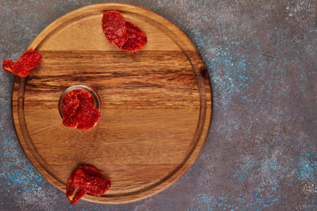 Fermented vegetarian canned food concept. Pickled dried tomatoes in a glass jar. The concept of canned food.の写真素材