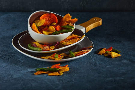 Dry fruit and Healthy vegetable chips, healthy vegan snack, a mixed heap: yellow sweet potato purple...
