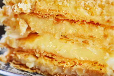 Napoleon cake on blue plate. Close upの写真素材