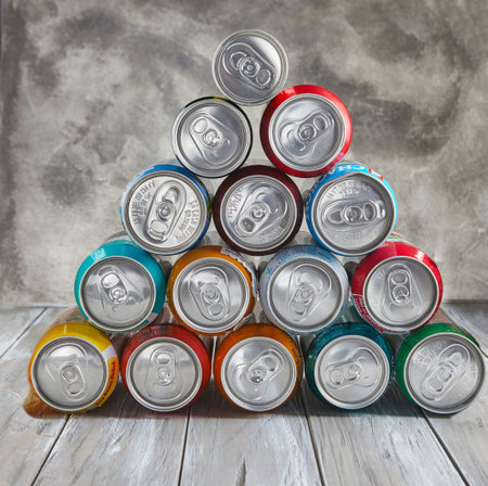 Tel Aviv, Israel - March 28, 2021: Drinks in cans stacked in a pyramid on the table.のeditorial素材