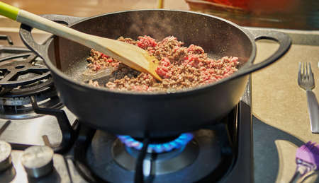Ground beef is fried in spaghetti bolognese pan according to recipe from the Internetの写真素材