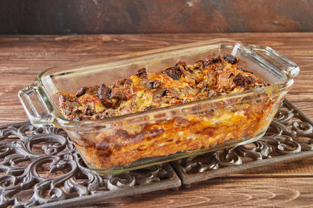 Clafoutis Roquefort cheese with mushrooms in glass form on metal standの写真素材