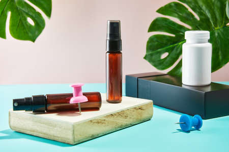 Mockup of bubbles and jars on catwalks with monstera leaves.の写真素材