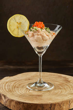 Smoked salmon mousse with red caviar in martini glass. French gourmet cuisine.の写真素材