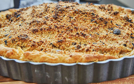 Pear pie and chocolate chips in metal pan after baking in the oven. French gourmet cuisineの写真素材