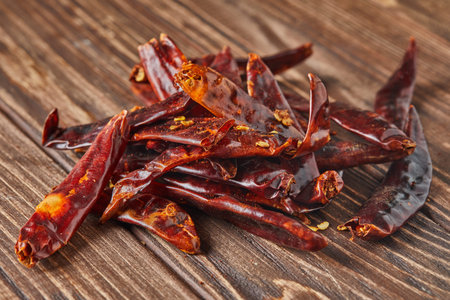 Dried red hot pepper on wooden vintage background.