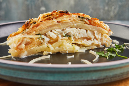 Fish gratin with potatoes and apples. Gourmet french food.