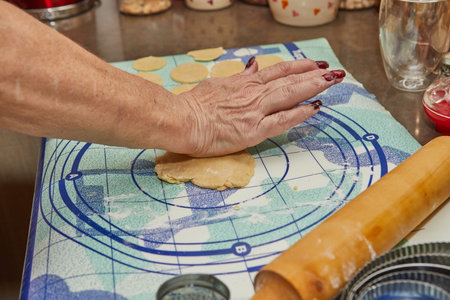 Chef prepares the dough and cuts out circles in a special shape.