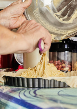 Chef pours the pie filling into the baking dishの写真素材