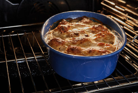 Bechamel sauce, cauliflower in ceramic bowl after baking in the oven