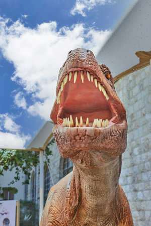 Life-size dinosaur figure in the park is an approximation to realityのeditorial素材