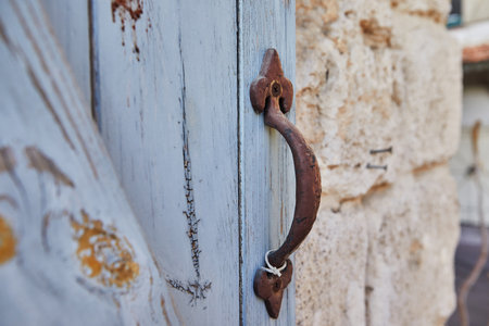 Texture Wooden blinds with metal handle and stone wall.の写真素材