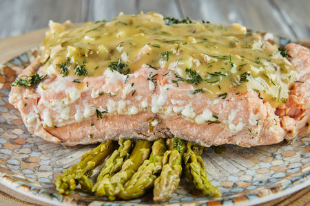 Salmon fillet in Remoulade sauce in white wine with asparagus.の写真素材