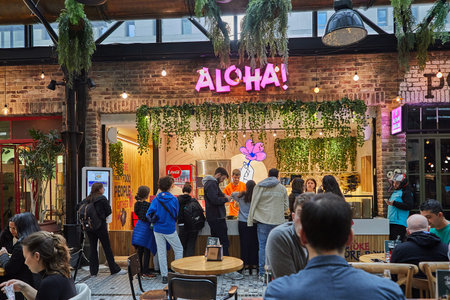 Food shops, restaurants, cafes and grocery stores at Sarona Organic Market, modern food market in...