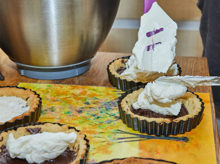 Manufacturing process Round cream pie with chocolate and strawberries. French recipe