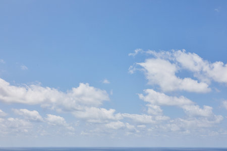 Background texture of blue sky with cumulus cloudsの写真素材