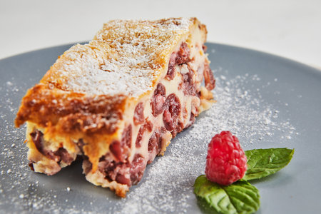 Cherry pies with vanilla, cherry liqueur and raspberriesの写真素材