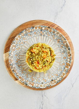 Quinoa pilaf with carrots, zucchini and green peas. Flat lay.の写真素材