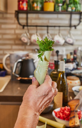 Chef keeps the finished bouquet or bunch of greenery in the kitchen to decorate the dish. Close-upの写真素材