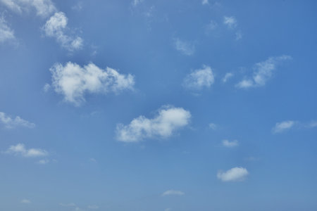 Background texture of blue sky with cumulus clouds.の写真素材