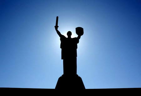 \Motherland\ monument rises above Kiev on the right bank of the Dnipro and looks like a figure of a...